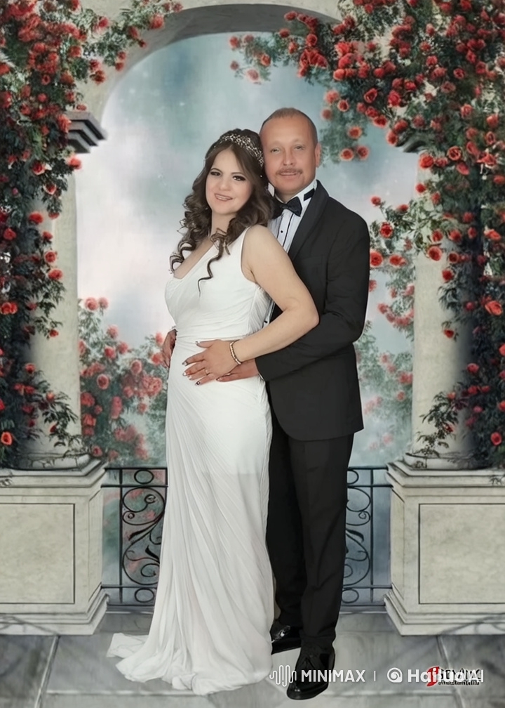 Family Celebration: Couple and Baby Dancing in a Rose Garden