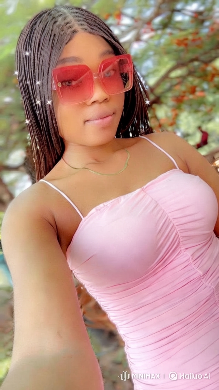 Woman Embraces Strength in Soft Pink Dress - No Apologies