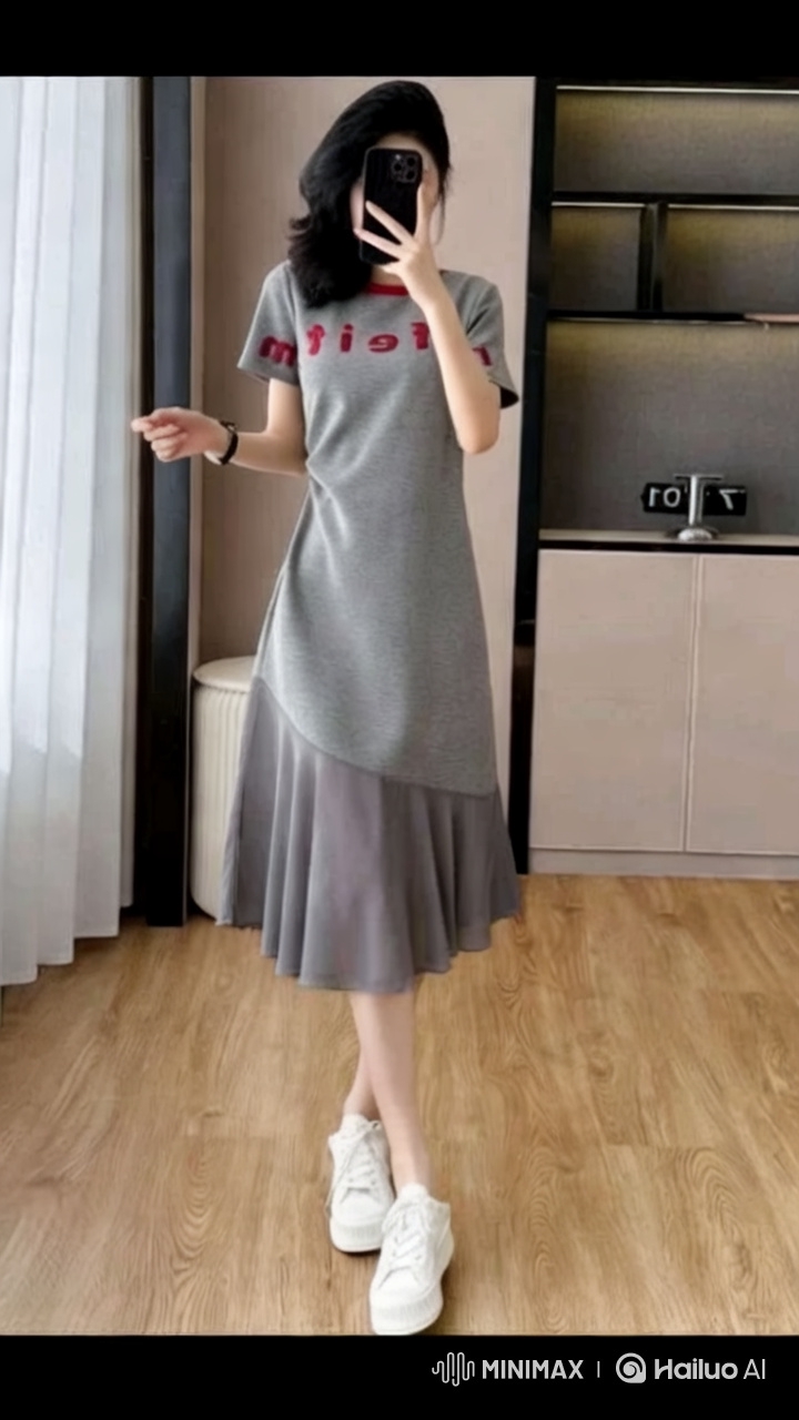 Fashion Model Showcases Stylish Grey Dress