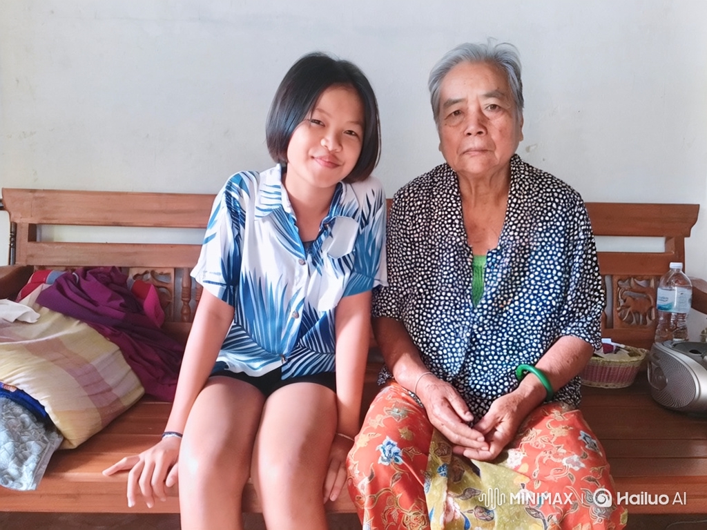 Elderly Woman and Young Girl Share Tender Embrace