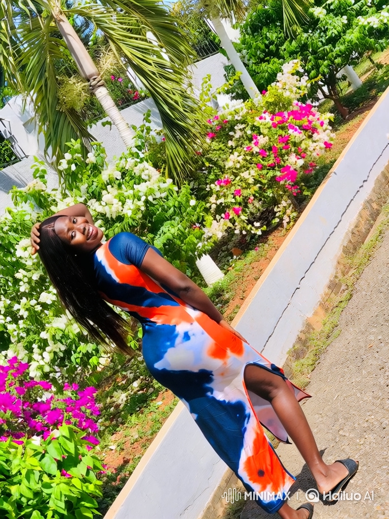 Young Woman Poses and Walks in Garden in Vibrant Tie-Dye Dress
