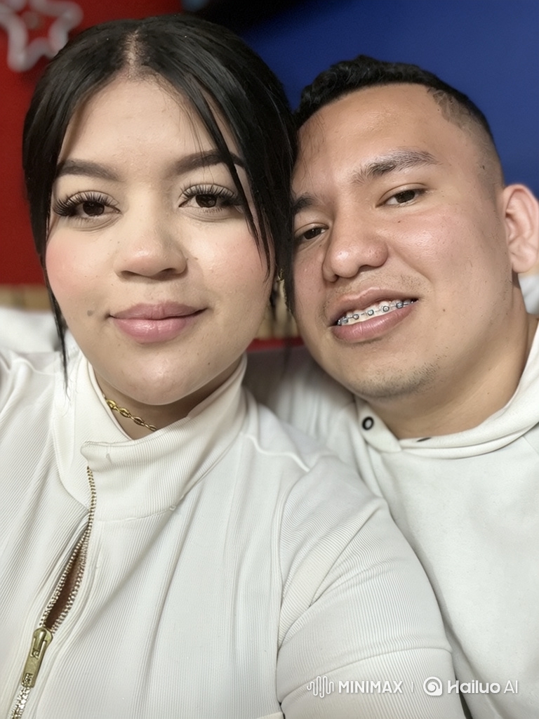 Couple and Daughter Embrace in Intimate Family Moment