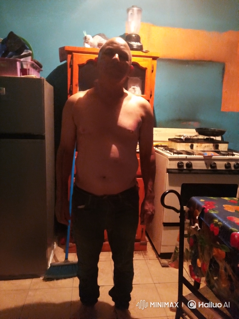 Bald Man Performing Hip Dance in Kitchen