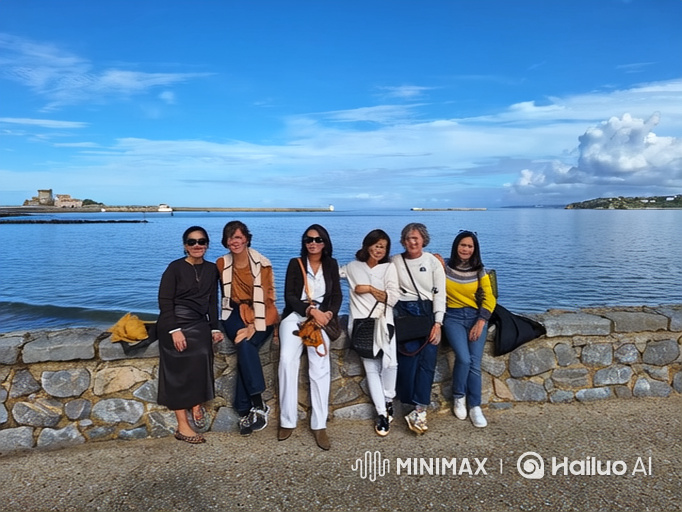 Women Enjoy Dance Transformation on Seawall to Beach Setting