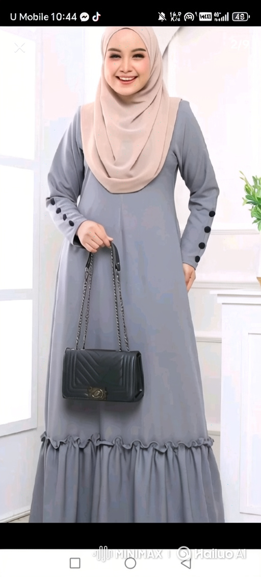 Woman in Elegant Dress Struts Gracefully in Modern Mall