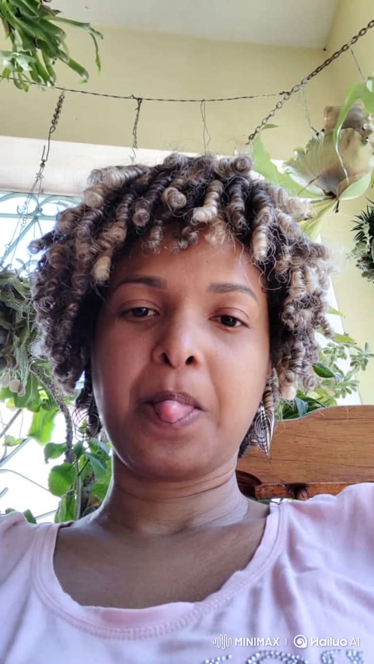 Portrait of a Woman with Gentle Smile and Swaying Plants