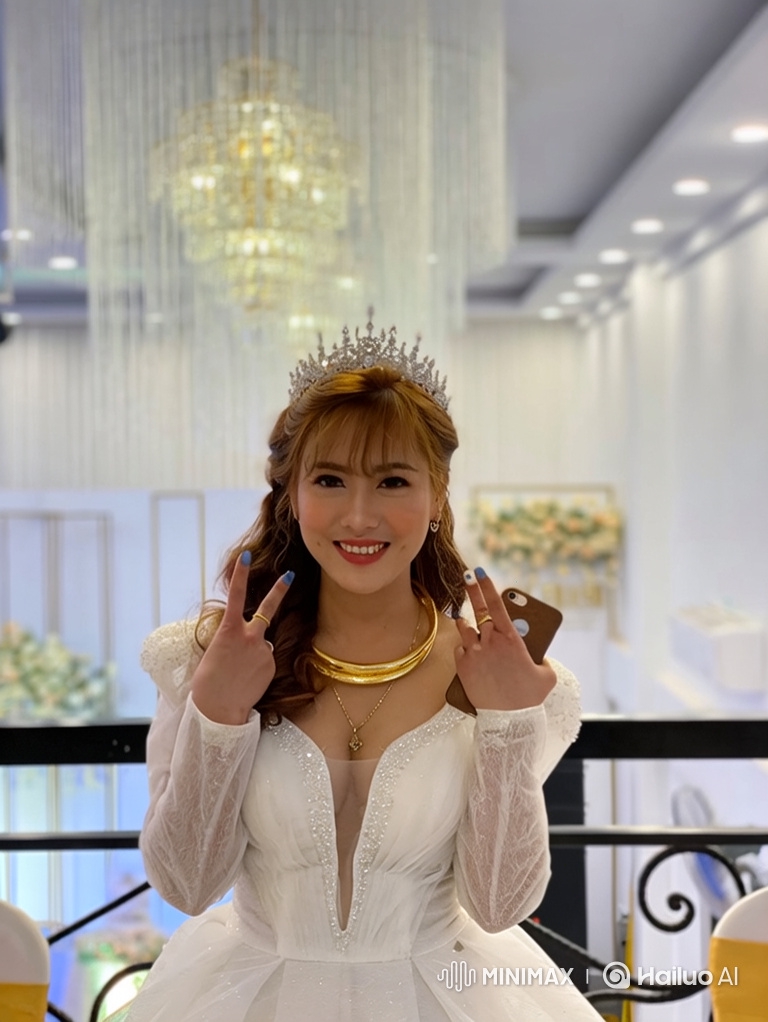 Radiant Young Woman in Elegant Gown with Peace Signs