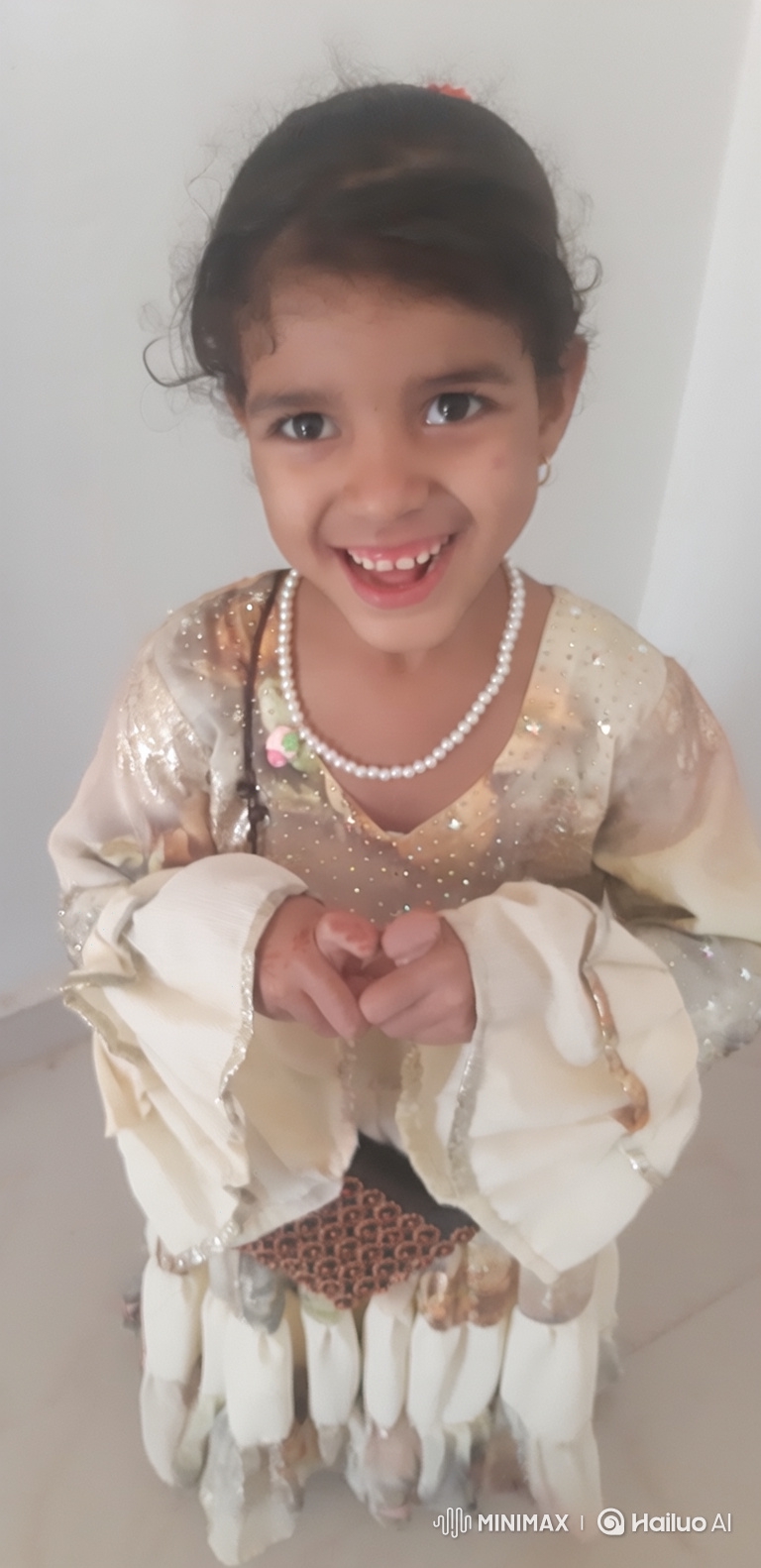 Young Girl in Ornate Dress Invites Viewers Warmly