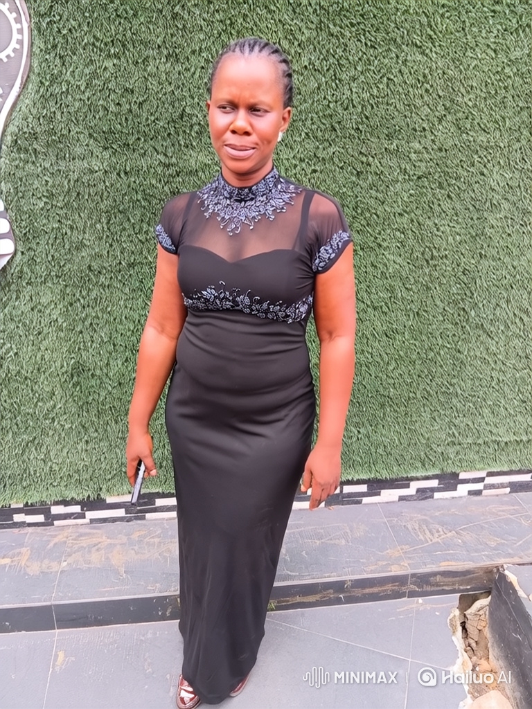 Woman in Black Gown Exhibits Graceful Poise