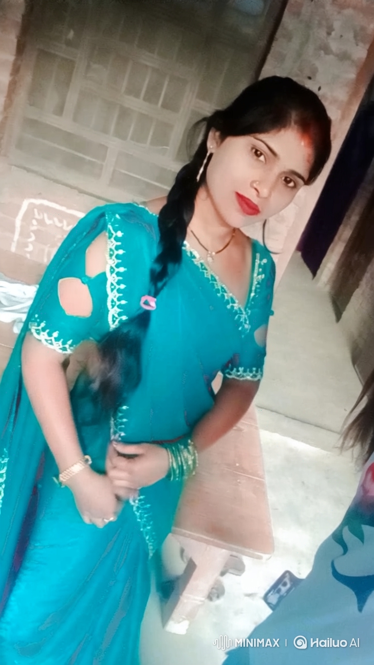 Woman in Teal Traditional Dress with Gentle Smile