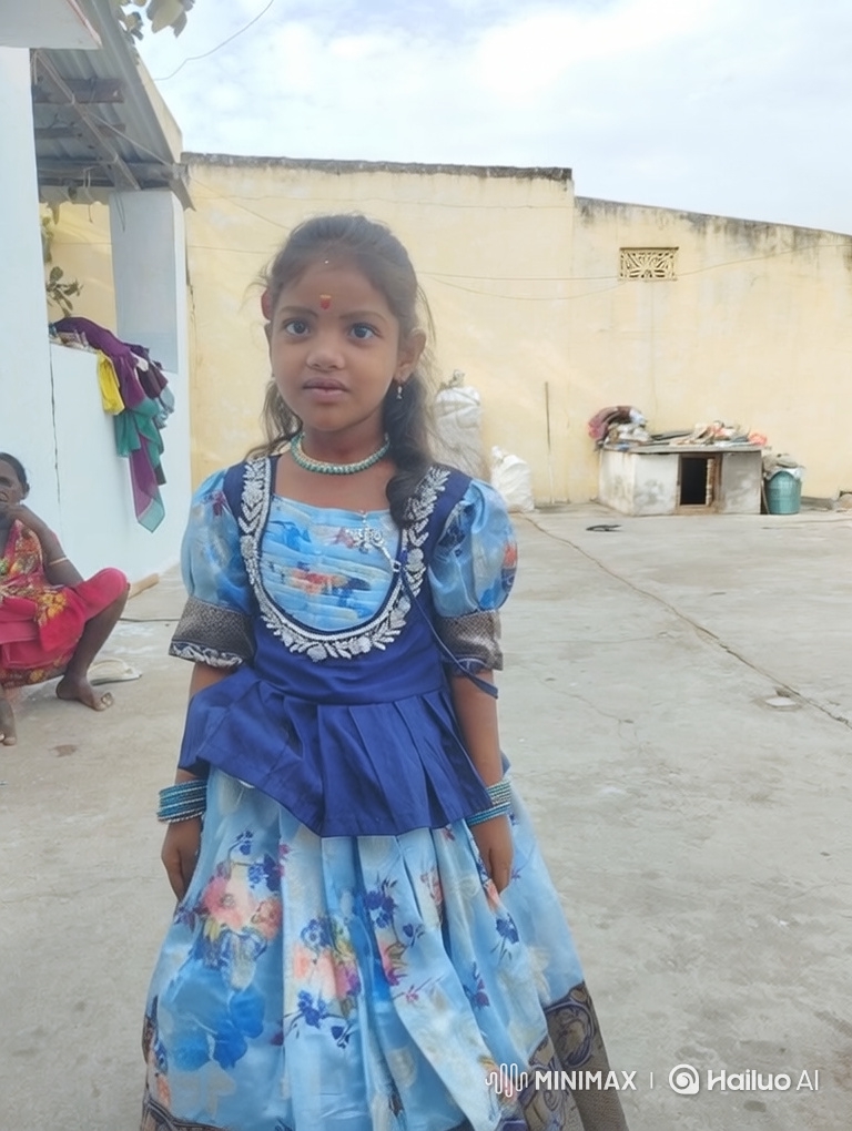 Young Girl in Floral Dress Smiles Gently