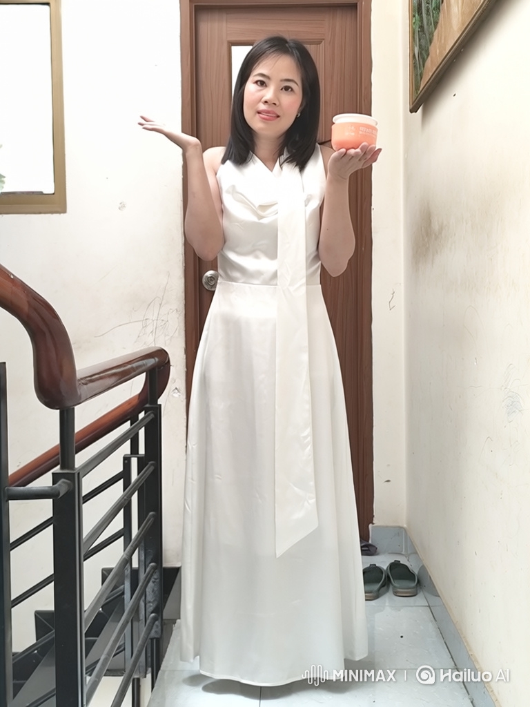 Elegant Asian Woman Presents Beauty Cream