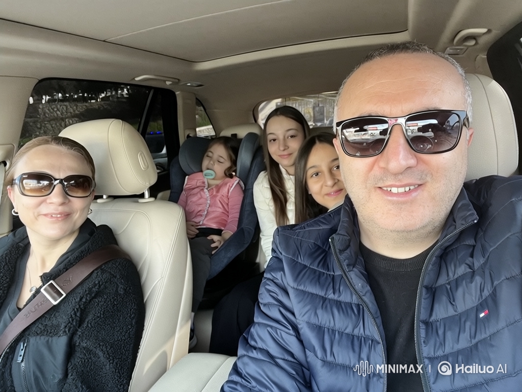 Car ride joy: Family dances, baby sleeps