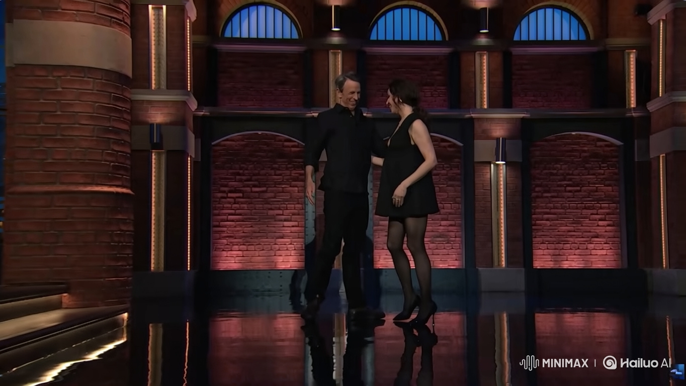 Couple's Tender Baby Bump Moment on Stage
